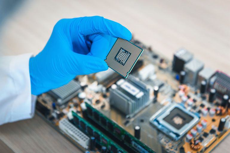 06-gettyimages-1060716122-1681753721 Close up portrait of computer engineer's hand is holding CPU's computer.
