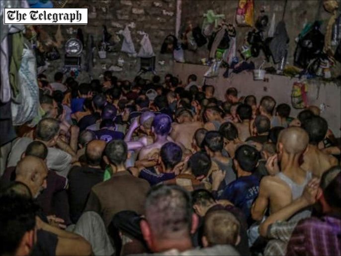 0997bb50-744c-4ca9-a17f-3d76cce5cbc7 Suspected Islamic State member sit inside a small room in a prison south of Mosul,CREDIT: AP