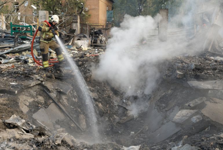 11729946-1695289877 epa10873777 A Ukrainian rescuer works at the site where debris from a missile fell on a residential area in Kyiv (Kiev), Ukraine, 21 September 2023, amid the Russian invasion. Ukraine recorded 43 rocket attacks overnight, 36 of which were shot down, the Ukrainian Air Force said. As a result of falling debris, damage was reported in the capital Kyiv's districts of Darnytskyi, Solomyanskyi, Shevchenkivskyi, Ihor Klymenko, Ukraine's Minister of Internal Affairs wrote on telegram, adding that fires broke out in the Darnytskyi district injuring seven people, including a child. EPA-EFE/SERGEY DOLZHENKO