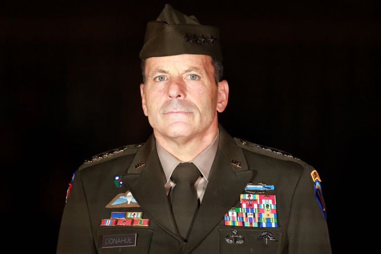 14228877-1787686441 epa13181508 Former commander of the US Army in Europe and Africa General Christopher Donahue looks on during a Grand Tattoo in his honor in Berlin, Germany, 20 August 2026. Donahue was commander of the US Army in Europe and Africa from 10 December 2024 to 02 July 2026, in Wiesbaden, Germany. EPA/CLEMENS BILAN