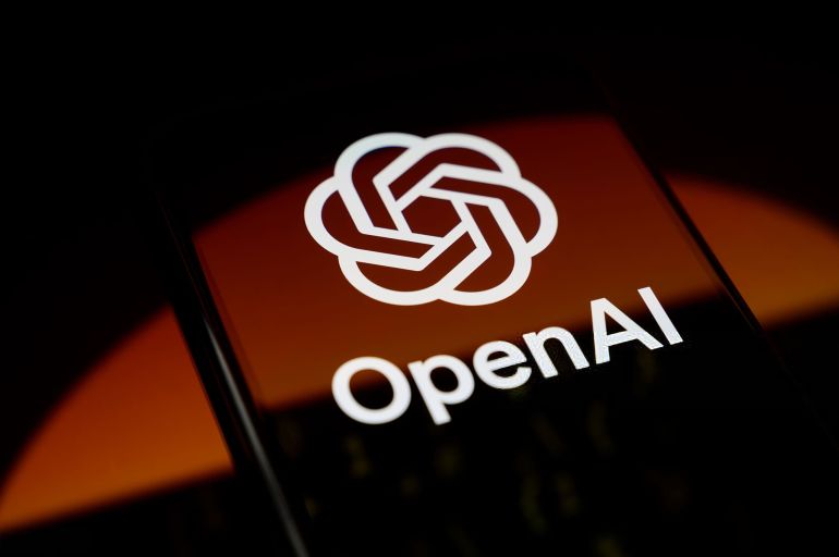 21shsy-1781514080 The OpenAI logo is displayed on a smartphone screen placed on a reflective surface onto which the Daybreak visual is projected, in Creteil, France, on May 12, 2026. Daybreak is an AI-powered cybersecurity service designed to detect, analyze, and remediate software vulnerabilities more quickly. (Photo by Samuel Boivin/NurPhoto via Getty Images)