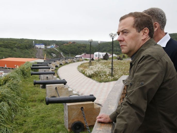 2ea1f1e4-4e76-45b2-8ae4-23183568c9ad 001 - -, -, RUSSIAN FEDERATION : Russian Prime Minister Dmitry Medvedev inspects a port station in the Kitovyi village as he visits Iturup island, one of four islands in the chain that lies off Russia's far eastern coast and just north of Japan, on August 22, 2015. Russian Prime Minister Dmitry Medvedev landed Saturday in the Kuril islands, prompting a swift rebuke from Tokyo, which claims sovereignty over the northwest Pacific archipelago in a long-running dispute. AFP PHOTO / RIA NOVOSTI / DMITRY ASTAKHOV