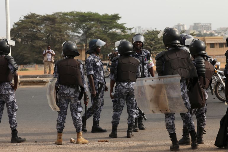 3-1-1713005574 Riot police officers stand guard as they try to stop protesters from gathering in front of the College Saint Joseph in Lome, Togo February 28, 2020. REUTERS/Luc Gnago