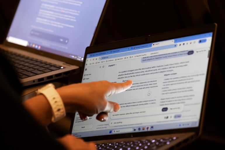 3ai-1787740051 2 of 5 | Teachers work with Al on their laptops during the Charleston County School District Charleston Educator Symposium Wednesday, July 22, 2026, in North Charleston, S.C. (AP Photo/Mic Smith)