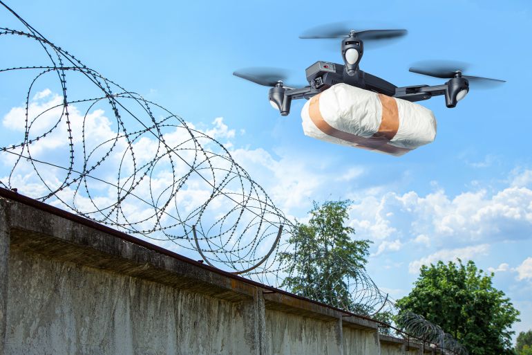 456754-1786465754 The drone flew across the sky with smuggling. The drone transports forbidden goods across the border breaking the law. Delivery of drugs through the wall ... See More by adragan @ادوبي ستوك
