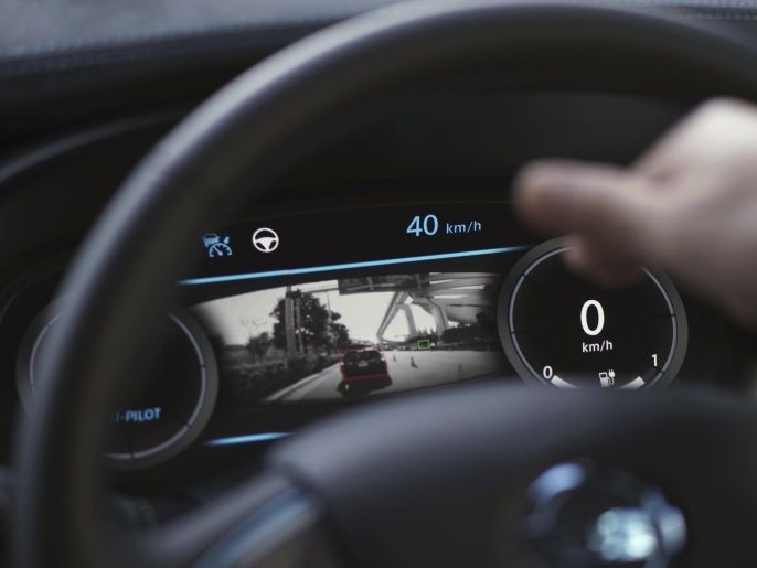 The dashboard panel of Nissan's automated driving test vehicle shows the test vehicle detecting other car during a test drive in Tokyo, Tuesday, Nov. 3, 2015. Nissan Motor Co.'s "intelligent driving" feature is smart enough to navigate intersections without lane markers. It also brakes safely to a stop without crashing into the vehicle in front, and it knows the difference between a red light and a tail-lamp. (AP Photo/Eugene Hoshiko)