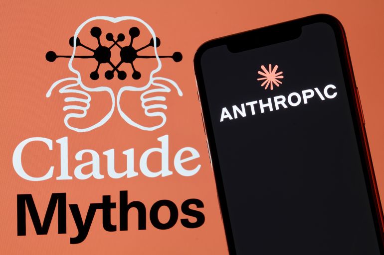 567cabfa-1779106653-1 A red-framed smartphone displaying the Anthropic corporate logo is positioned in front of an orange background featuring the Claude Mythos product branding alongside a symmetrical illustration depicting two human brain or face profiles joined and interconnected by a neural network diagram in San Ferdinando di Puglia, Italy, on May 17, 2026. The Claude Mythos wordmark appears below in white and black serif typography. The composition represents Anthropic's visual identity for its expanded AI product portfolio. (Photo Illustration by Matteo Della Torre/NurPhoto via Getty Images)