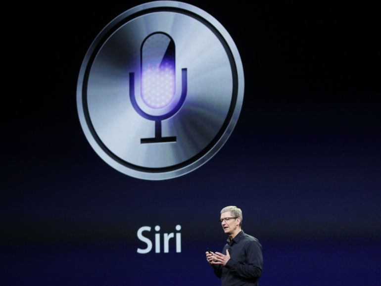 CEO Tim Cook talks about Siri during an Apple event in San Francisco, California March 7, 2012. REUTERS/Robert Galbraith (UNITED STATES - Tags: SCIENCE TECHNOLOGY)