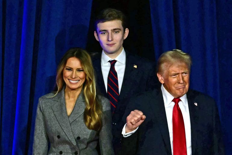 8465312-1771241315 Former US President and Republican presidential candidate Donald Trump (R) arrives for an election night event alongside former US First Lady Melania Trump and his son Barron Trump at the West Palm Beach Convention Center in West Palm Beach, Florida, on November 6, 2024. (Photo by Jim WATSON / AFP)