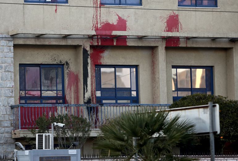 8704194-1787439200 epa06405558 Members of the anarchist group Rouvikonas threw paint at the entrance of the Israeli Embassy early morming in Athens, Greece, 25 December 2017, in solidarity to the Palestinian people as the group announced. EPA/SIMELA PANTZARTZI