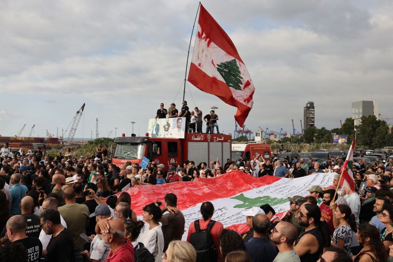 afp_6891f5054d67-1754395909 Lebanese demonstrators march during a gathering to honour the victims of the catastrophic port explosion in 2020 and to call for accountability for the blast, in Beirut on August 4, 2025.