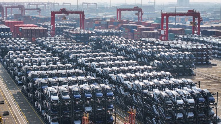 (FILES) BYD electric cars waiting to be loaded onto a ship are seen stacked at the international container terminal of Taicang Port in Suzhou, in China’s eastern Jiangsu province on February 8, 2024.