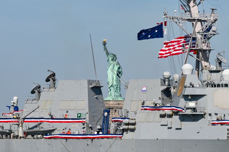 afp_6a49611cb838-1783193884 This photograph shows a view of the US Navy guided-missile destroyer Farragut and the Statue of Liberty ahead of the Sail4th 250 parade of ships in New York Harbor for the United States 250th anniversary on Independence Day in New York on July 4, 2026.