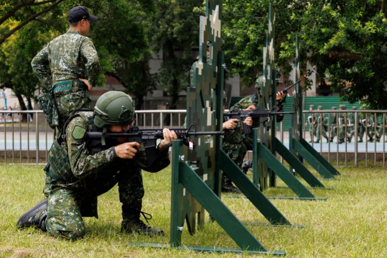 afp_6a73562116a5-1785943585 Taiwanese military reservists from an infantry battalion of the Taipei City Reserve Brigade take part in combat training in Taipei on August 5, 2026. (Photo by CHENG Yu-chen / AFP)