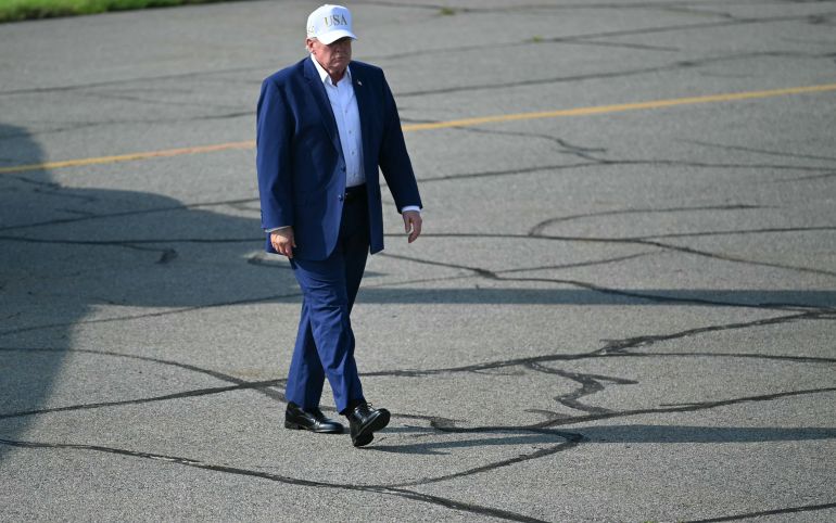 afp_6a7976fac071-1786345210 US President Donald Trump walks to board Air Force One before departing from Morristown Municipal Airport in New Jersey, on August 9, 2026.