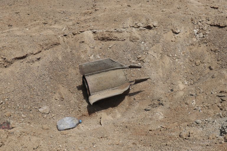 The remains of a military projectile are embedded in the ground in the Port of Mokha the day after an attack by the Houthis on the city of Mokha, held by Yemen's internationally recognised, Aden-based government on 10 August 2026.