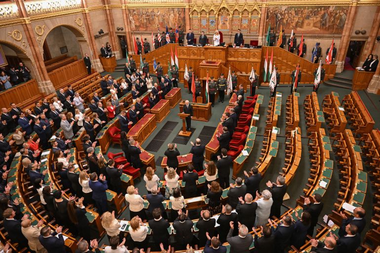 afp_6a7b4de53b71-1786465765 Hungary's newly elected President Andras Baka (C) is applauded after he was elected at the parliament in Budapest on August 11, 2026.