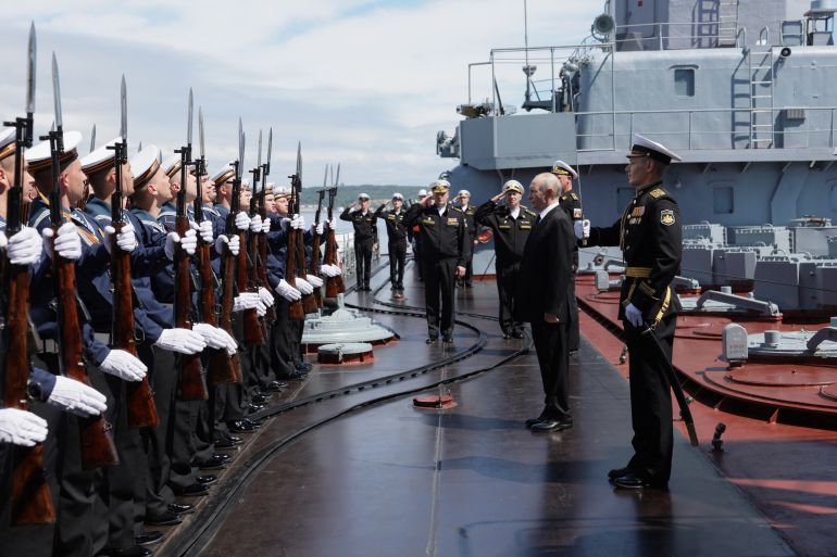 afp_6a7c3ca0491f-1786526880-1 In this pool photograph distributed by the Russian state agency Sputnik, Russia's President Vladimir Putin visits the Russian Navy's guided missile cruiser Varyag as he oversees the final stage of a Pacific Fleet's naval drills on far eastern Sakhalin Island on August 12, 2026. (Photo by Gavriil Grigorov / POOL / AFP)