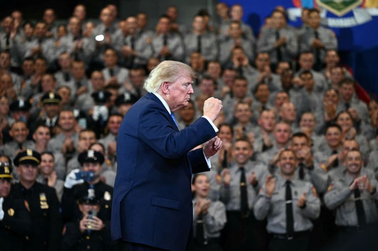 US President Donald Trump gestures as he departs after delivering remarks at the Nassau County Police Academy Center for Training and Intelligence in Garden City, New York, on August 14, 2026. (Photo by Kent NISHIMURA / AFP)