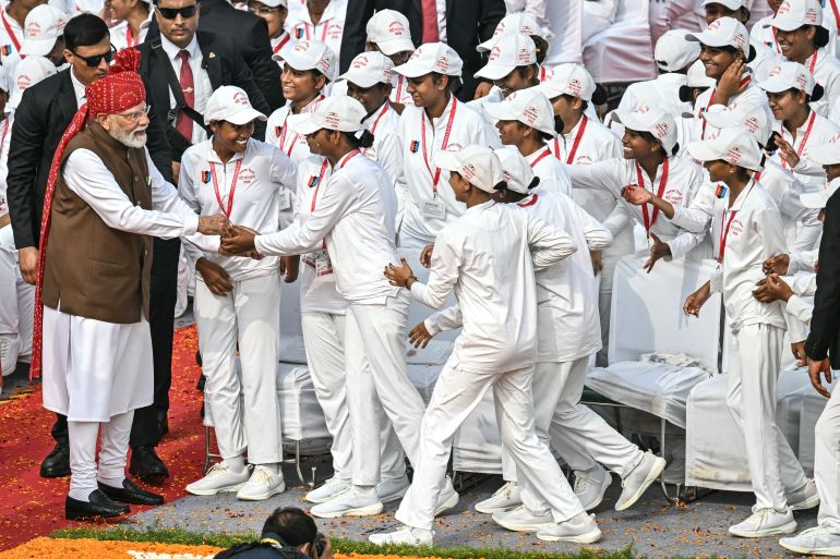 afp_6a804bb7355a-1786792887 TOPSHOT - India's Prime Minister Narendra Modi (L) meets with the members of National Cadet Corps (NCC) after addressing the nation at the Red Fort during the celebrations to mark country's Independence Day in New Delhi on August 15, 2026. (Photo by Sajjad HUSSAIN / AFP)
