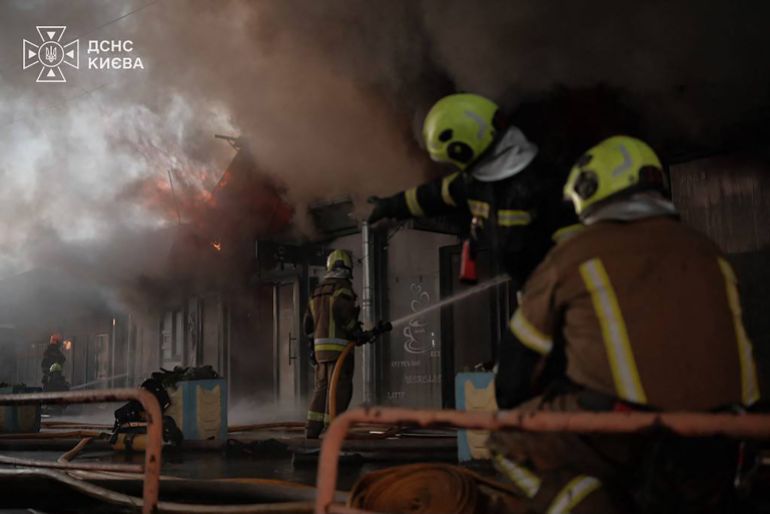 afp_6a813d25617f-1786854693 This handout photograph taken and released by the Ukrainian State Emergency Service on August 16, 2026 shows rescuers working at the site of a Russian strike in Kyiv, amid the Russian invasion of Ukraine.