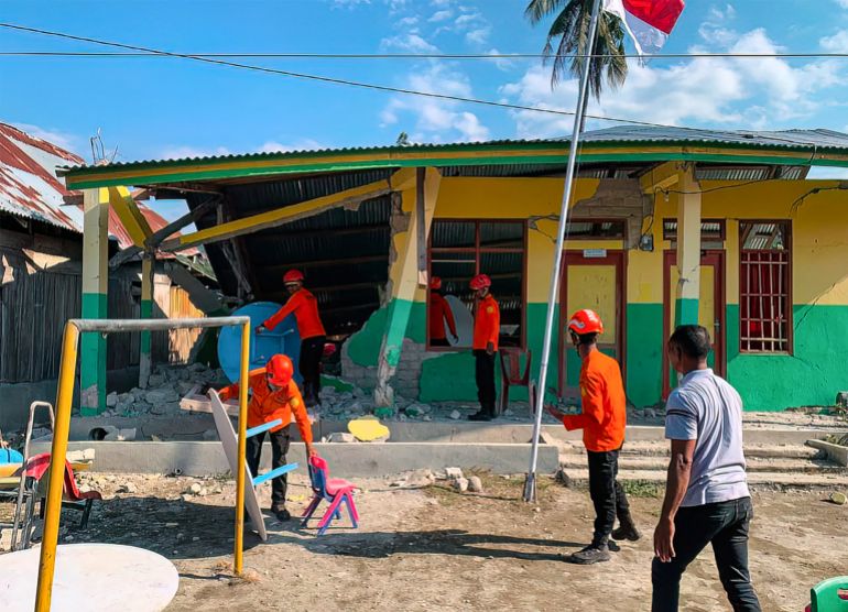 afp_6a82f02c84de-1786966060 This handout picture taken and released on August 17, 2026 by Indonesia's National Search and Rescue Agency (BASARNAS) shows rescuers conducting operations in a damaged building following a 7.7-magnitude earthquake in Satar Kampas village, East Manggarai, East Nusa Tenggara.