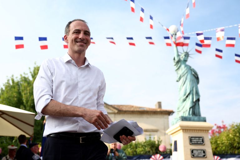 afp_6a8b80ec349e-1787527404 (FILES) French politician, centre-left party Place publique's leader and MEP Raphael Glucksmann walks during the 100th anniversary of the unveiling of the Statue of Liberty, which was donated to the city by a local man named Rey Jeanton, in Izon near Bordeaux, south-western France, on July 14, 2026.
