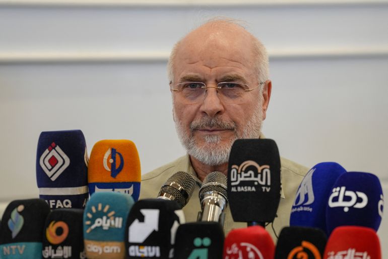 Iran's Parliament Speaker Mohammad Bagher Ghalibaf speaks during a visit to the grave of Abu Mahdi al-Muhandis, a commander of Hashed al-Shaabi, an armed Iraqi alliance that includes pro-Iran groups, at Wadi al-Salam cemetery in the central holy city of Najaf on August 21, 2026.