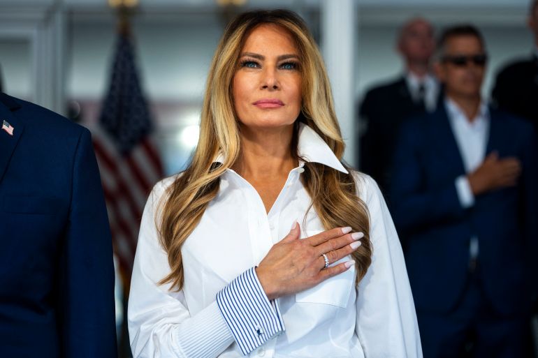 US First Lady Melania Trump listens to the national anthem at the start of the race, during the Freedom 250 Grand Prix Race on the streets of Washington, DC, on August 23, 2026.