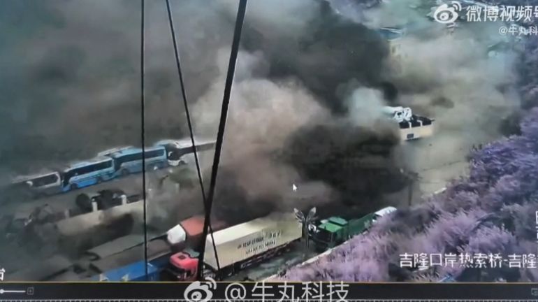 afp_6a8fd429a051-1787810857 TOPSHOT - Screen recordings of surveillance camera footage posted on Chinese social media platforms, reportedly show flash flooding hitting the Gyirong Port in the Tibet Autonomous Region on August 26, 2026.