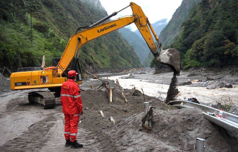 Workers repair a section of road leading to Gyirong Port which was damaged after a mudslide two days earlier, in Gyirong County, in China’s western Tibet region on August 28, 2026. (Photo by CNS / AFP) / CHINA OUT