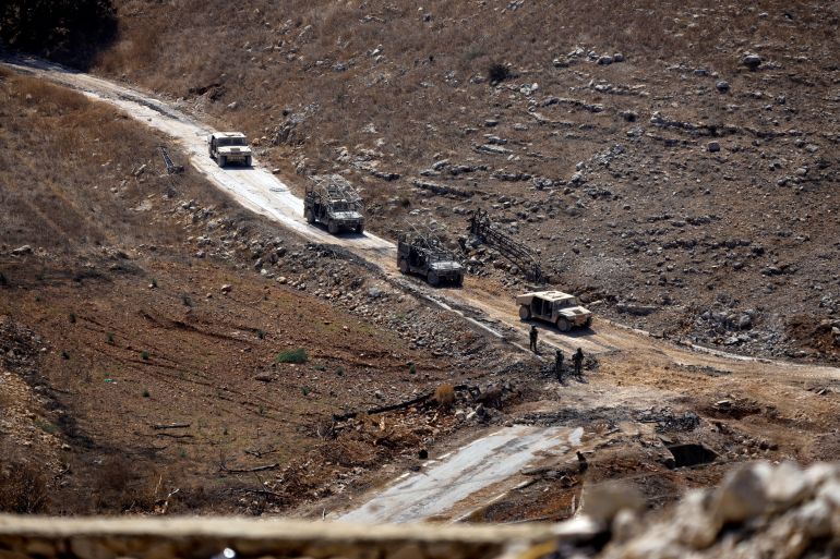afp_6a916033ef98-1787912243 A photograph taken from the southern Lebanese village of Chaqra shows an Israeli military convoy driving through the nearby area of Wadi al-Slouki on August 21, 2026.
