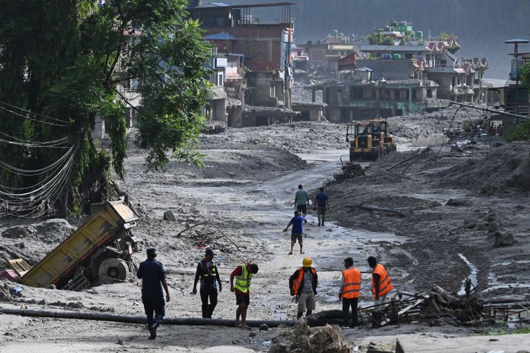 Rescue works continue at Trishuli Center in Nepal's Nuwakot district on August 30, 2026, after catastrophic flooding on the Nepal-Tibet border.