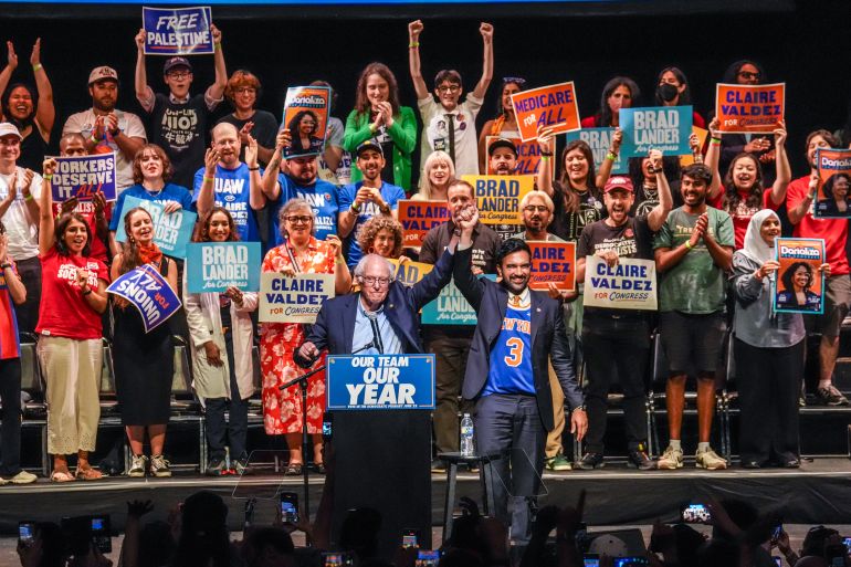 ap26170035813922-1781977033 New York City Mayor Zohran Mamdani, center right, gestures on stage with Sen. Bernie Sanders, I-VT., during a Get Out The Vote rally ahead of New York's primary election, Thursday, June 18, 2026, in the Brooklyn borough of New York. (AP Photo/Ryan Murphy)