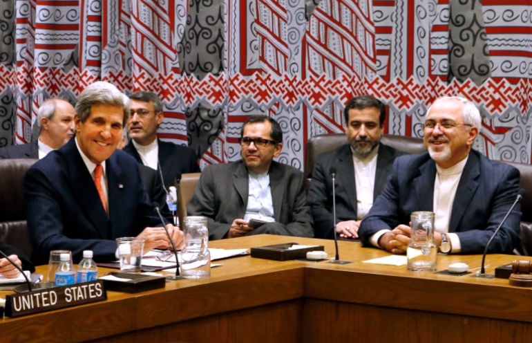 ap63349397821-1786983551 FILE - In this Sept. 26, 2013 file photo, U.S. Secretary of State John Kerry, left, and Iranian Foreign Minister Javad Zarif, right, attend a meeting of the five permanent members of the Security Council plus Germany during the 68th session of the United Nations General Assembly at the U.N. headquarters in New York. The five permanent U.N. Security Council members and Germany meet Iran in Geneva on Tuesday, Oct. 15, 2013 to try to reduce concerns that Tehran wants to build nuclear weapons while satisfying Irans demands to recognize its right to peaceful nuclear activities. (AP Photo/Jason DeCrow, File)