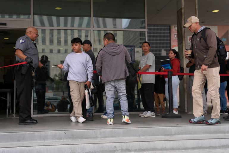 ap_6924d4bd8c6ad-1764021437 People line up outside the Los Angeles Federal Building in Los Angeles, housing the U.S. Immigration and Customs Enforcement (ICE) and U.S. Citizenship and Immigration Services (USCIS) on Wednesday, June 25, 2025. (AP Photo/Damian Dovarganes)