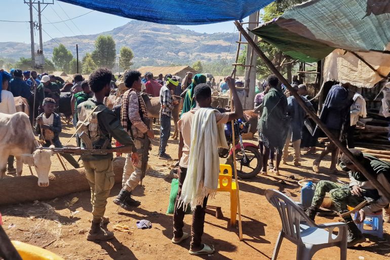 Fano militia members patrol Sangi livestock market, in the Amhara region of northern Ethiopia, Sunday, Jan. 23, 2025. (AP Photo)