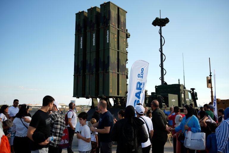 ap_69836ef283def-1770221298 People walk past an air defense system produced by Turkish weapons manufacturer Aselsan displayed during Teknofest fair, at Ataturk airport, in Istanbul, Turkey, Saturday, Sept. 20, 2025. (AP Photo/Emrah Gurel)