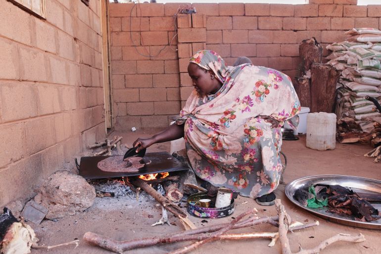 A woman prepares Helo Murr, a traditional Ramadan drink made with dried corn and spices which is then dipped in water to break Muslim's fasting, in Khartoum, Sudan, Monday, Feb. 9, 2026, ahead of the Muslim holy fasting month of Ramadan. (AP Photo/Marwan Ali)