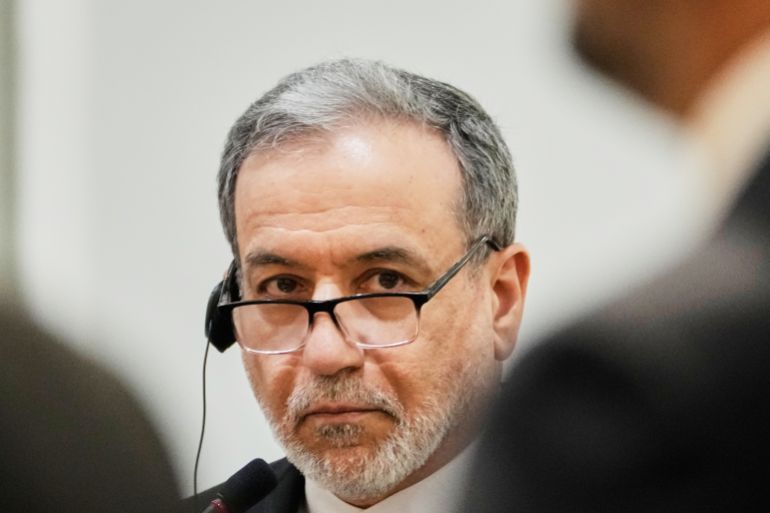 Iranian Foreign Minister Abbas Araghchi listens to his Iraqi counterpart Fouad Hussein during a news conference after a meeting at the foreign ministry in Baghdad, Iraq, Sunday, June 28, 2026. (AP Photo/Hadi Mizban)