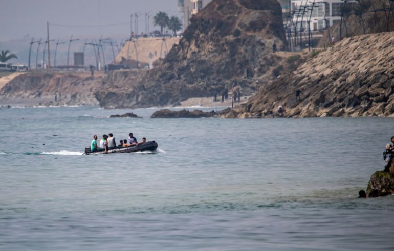 ap_6a6b5a0ed081b-1785420302 Migrants try to cross into the Spanish enclave of Ceuta from Morocco aboard a boat, Thursday, July 30, 2026. (AP Photo/Antonio Sempere)