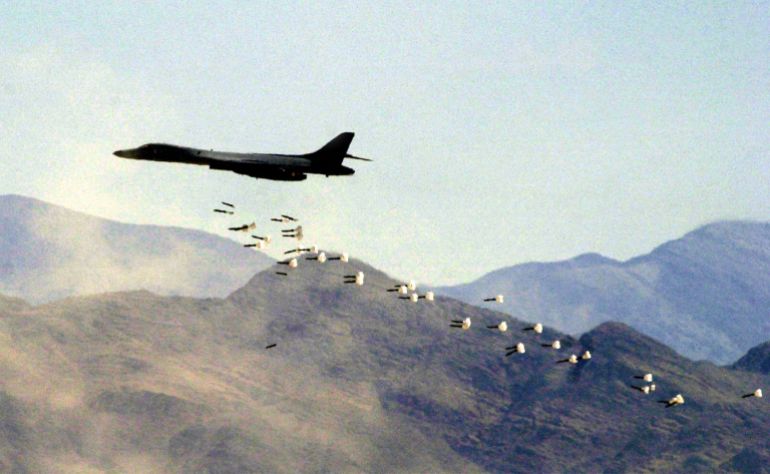 ap_6a6c8f492d17d-1785499465 A B1-B bomber drops live bombs at the Nevada Test and Training Range, Friday, July 19, 2002 in Indian Springs, Nev. The bombing run was part of the Joint Chiefs of Staff Capstone program,where top military brass get to watch live firepower displays. (AP Photo/Joe Cavaretta)