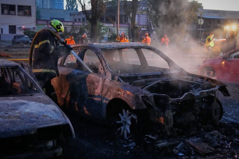 ap_6a729795930a9-1785894805 Emergency services personnel work to extinguish a fire following Russian missile attacks in Kyiv, Ukraine, Saturday, Aug. 1, 2026. (AP Photo/Efrem Lukatsky)