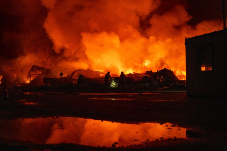 ap_6a7440ebaf79d-1786003691 Firefighters put out a fire after Russian missiles hit a warehouse in Kyiv, Ukraine, Wednesday, Aug. 5, 2026. (AP Photo/Dan Bashakov)