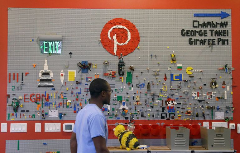 ap_6a770b1eef666-1786186527 In this Nov. 13, 2014 photo, a Pinterest employee walks past the Lego wall at the Pinterest office in San Francisco. The San Francisco-based venture capital darling celebrated its fifth birthday in March 2015. (AP Photo/Jeff Chiu)