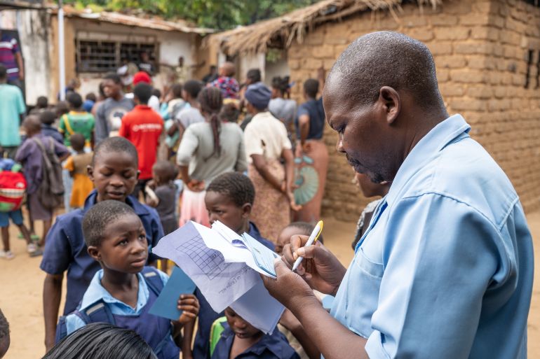 A health worker registers children for cholera vaccination in Blantyre, southern Malawi, Thursday, Jan. 22, 2026. (AP Photo/Thoko Chikondi)