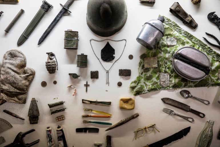 A variety of World War II items found on the landscape are displayed at the Truschbaum Museum in Elsenborn, Belgium, Friday, Aug. 21, 2026. (AP Photo/Valentin Bianchi)