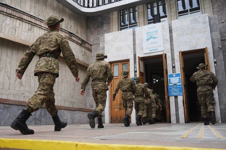 ap_6a8a8a7a893aa-1787464314 Kazakhstan's soldiers arrive to vote a polling station during early parliamentary elections in Almaty, Kazakhstan, Sunday, Aug. 23, 2026. (AP Photo/Vladimir Tretyakov)