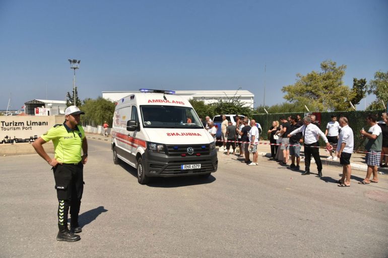 ap_6a94301d3713e-1788096541 An ambulance arrives at the port of Kyrenia in the Turkish occupied northern part of Cyprus, Sunday, Aug. 30, 2026, after a catamaran-style ferry overturned off the northern coast of Cyprus. (AP Photo)