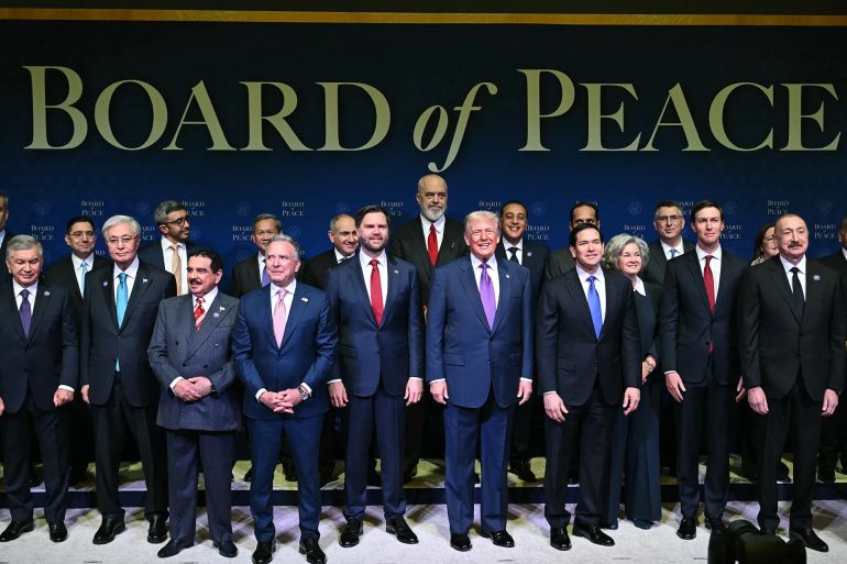 board-1771511023-1782582657 US President Donald Trump (C), flanked by US Vice President JD Vance (L) and US Secretary of State Marco Rubio (R), joins leaders for a group photo during the inaugural meeting of the "Board of Peace" at the US Institute of Peace in Washington, DC, on February 19, 2026. President Trump on Thursday gathers allies to inaugurate the "Board of Peace," his new institution focused on progress on Gaza but whose ambitions reach much further. Around two dozen world leaders or other senior officials have come to Washington for the meeting -- including several of Trump's authoritarian-leaning friends and virtually none of the European democrats that traditionally sign on to US initiatives. (Photo by SAUL LOEB / AFP)